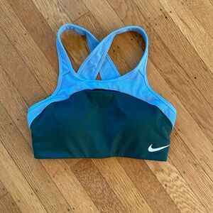 Nike blue and green Dri-Fit sports bra with neon yellow back strap